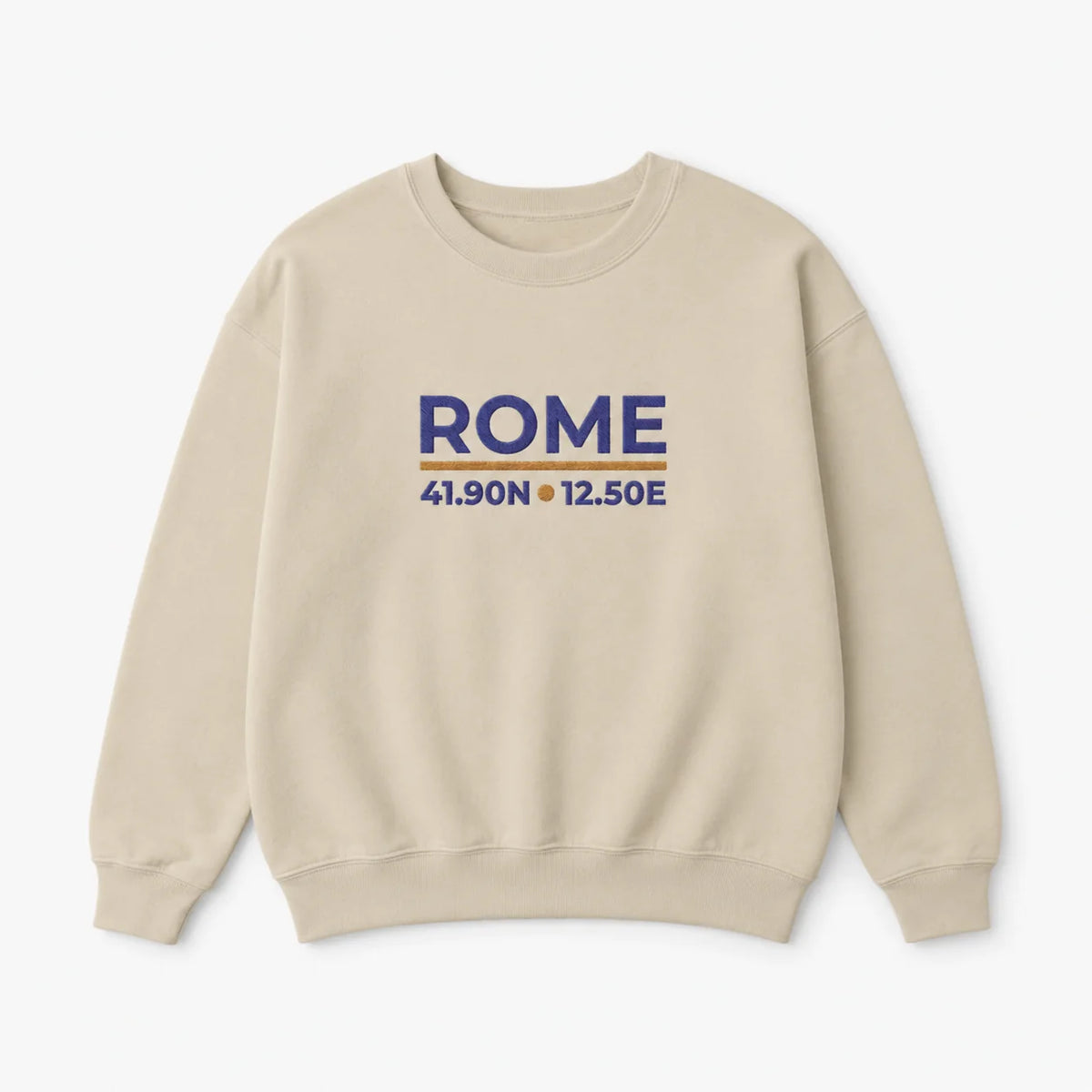 A beige crewneck sweatshirt with 'ROME' and geographical coordinates embroidered in blue on the chest, displayed on a clean white background.