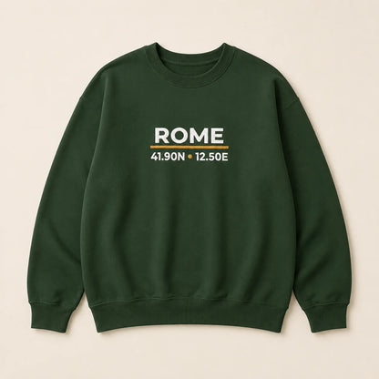 A dark green crewneck sweatshirt with 'ROME' and coordinates embroidered on the chest, displayed flat against a light beige background.
