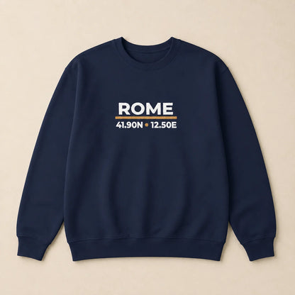 A navy blue crewneck sweatshirt with 'ROME' and coordinates embroidered on the chest, displayed flat against a light beige background.