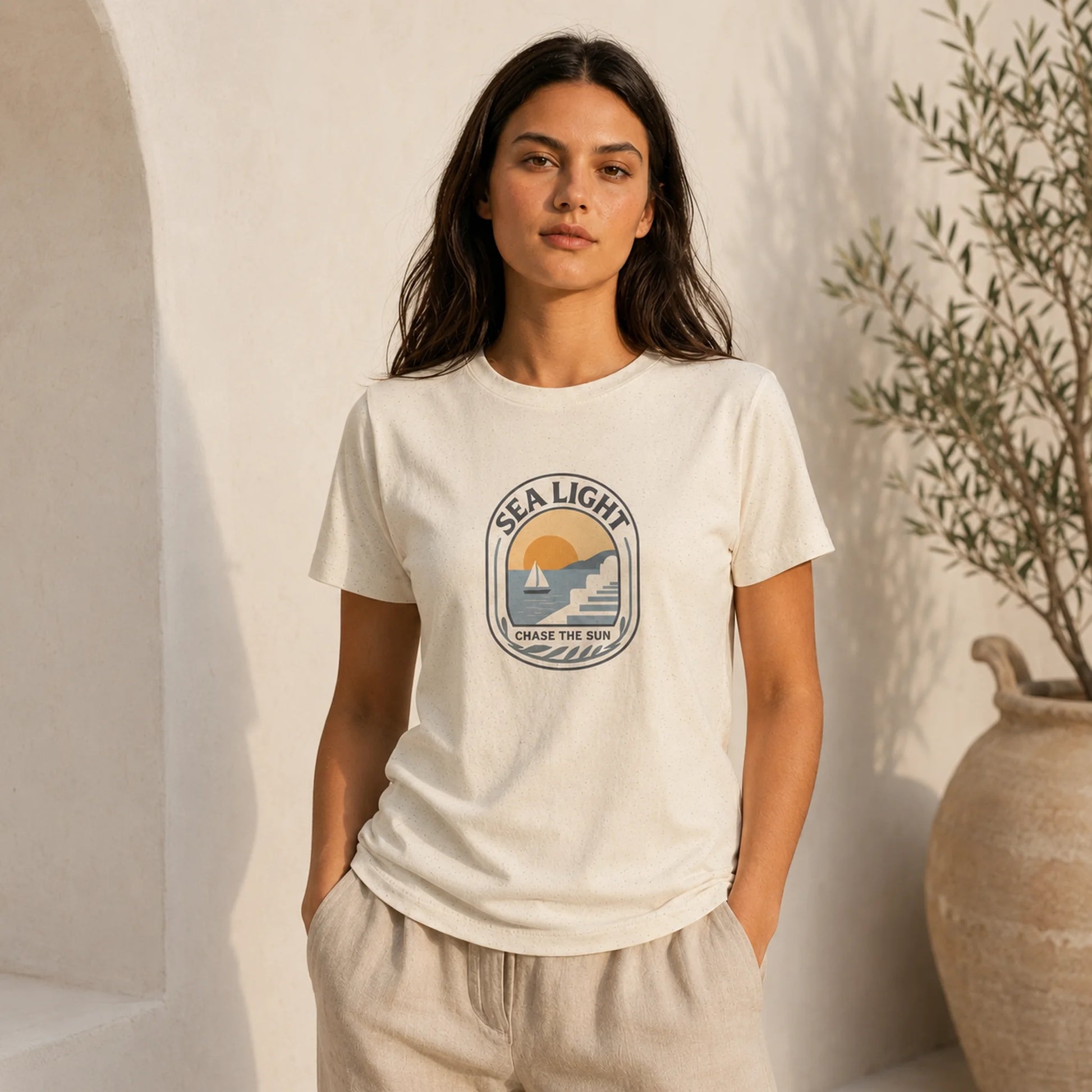 Woman wearing a white t-shirt with 'Sea Light' logo against a neutral background