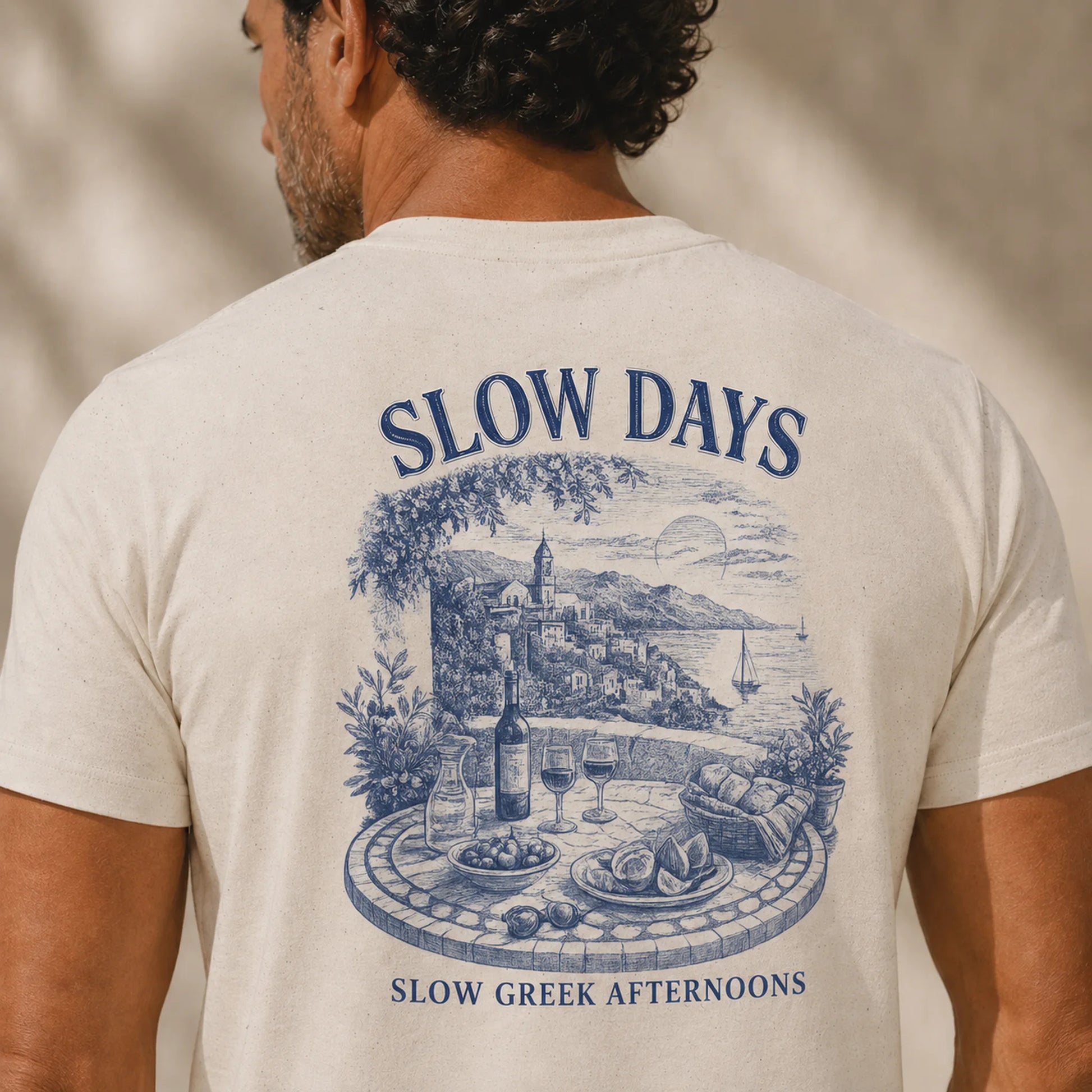 TP HERO: Person wearing a t-shirt with 'Slow Days' and 'Slow Greek Afternoons' design on the back.