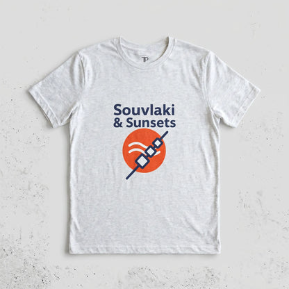 White t-shirt with 'Souvlaki & Sunsets' design on a light gray background
