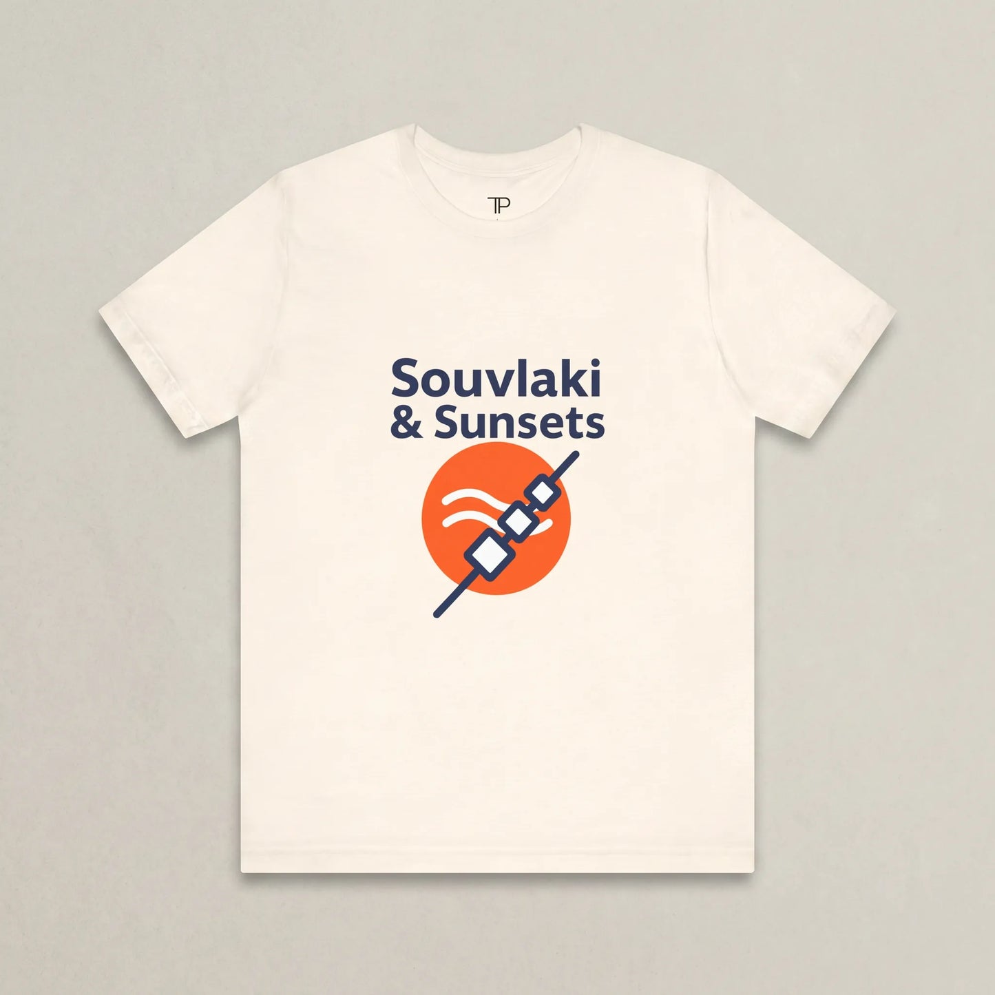 White t-shirt with 'Souvlaki & Sunsets' design on a gray background