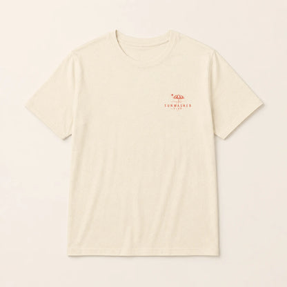 Beige t-shirt with a small red logo on a light beige background