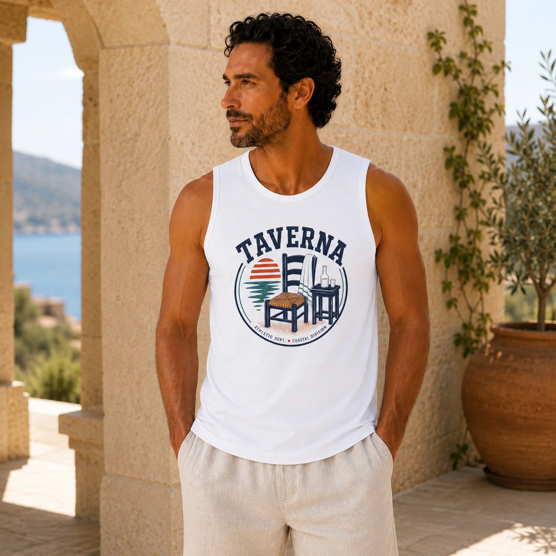 Man wearing a white tank top with 'Taverna' logo outdoors.