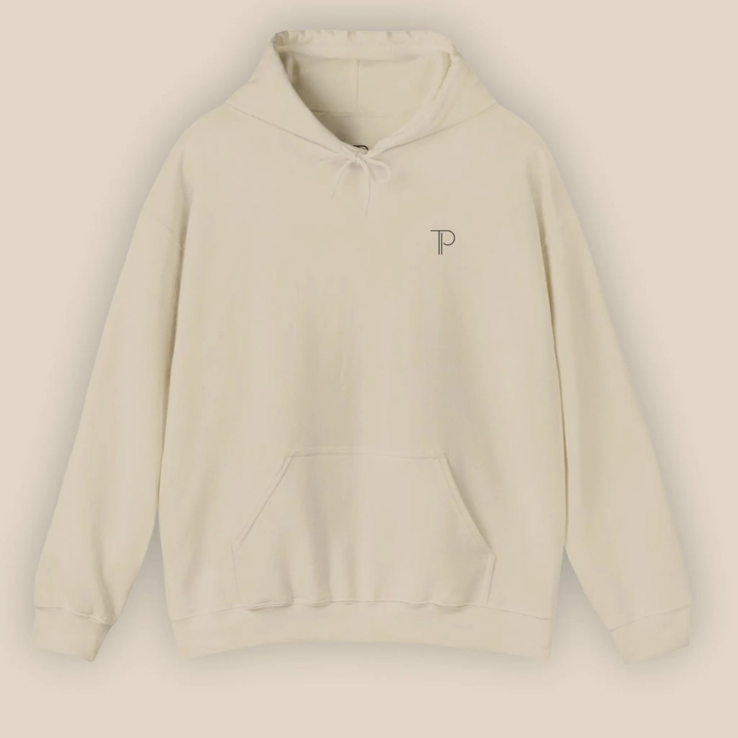 Flat lay of sand Abstract Muse Face hoodie showing chest design