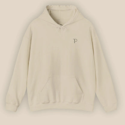 Flat lay of sand Abstract Muse Face hoodie showing chest design