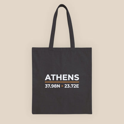 Black cotton canvas tote bag with Athens coordinates print, front view.