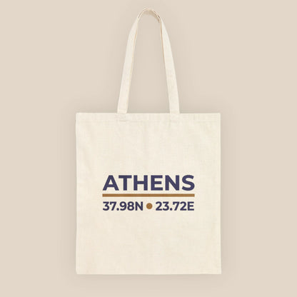 Natural cotton canvas tote bag with Athens coordinates print, front view.