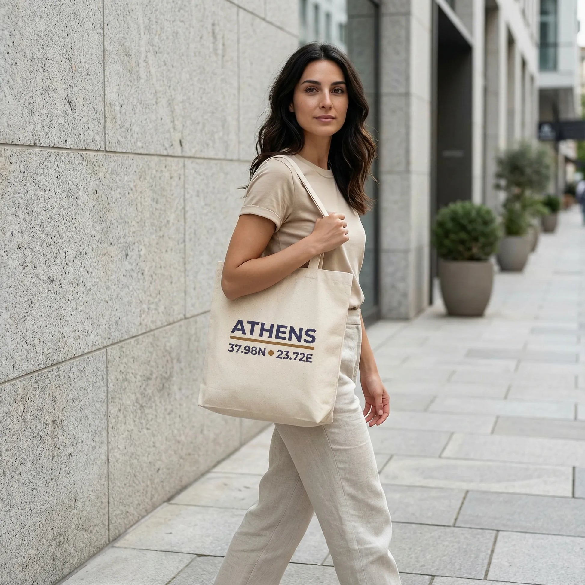Natural Athens coordinates tote bag in an urban street-style lifestyle photo.