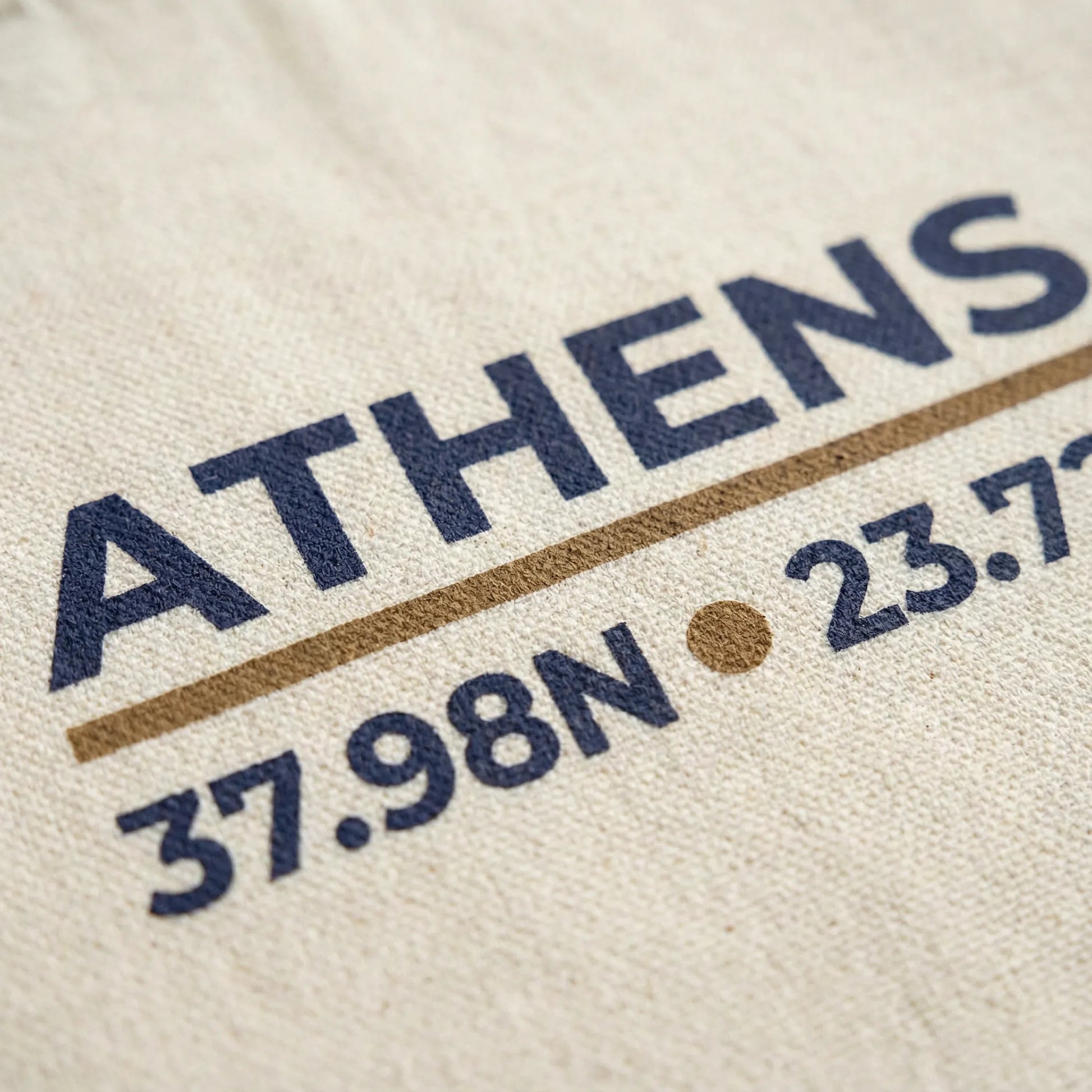 Close-up of Athens coordinates print on natural canvas tote fabric.