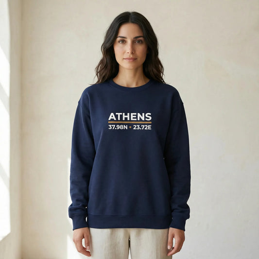 TP:HERO Navy Athens coordinates embroidered crewneck sweatshirt on model in bright neutral studio background, front view with chest embroidery visible.