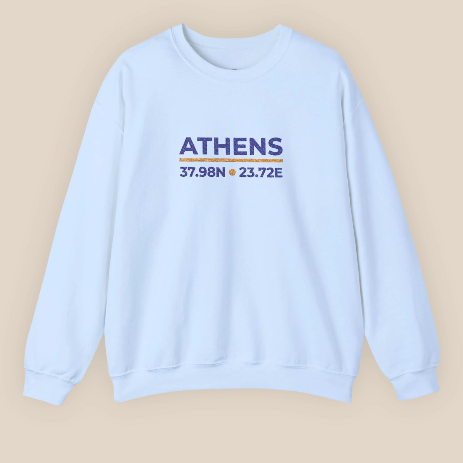 Light blue Athens coordinates embroidered crewneck sweatshirt flat lay on neutral background