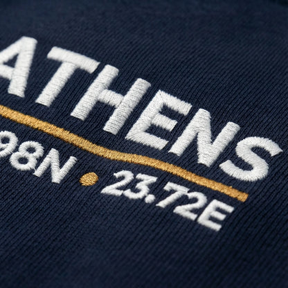 Close-up of embroidered Athens coordinates detail on crewneck sweatshirt
