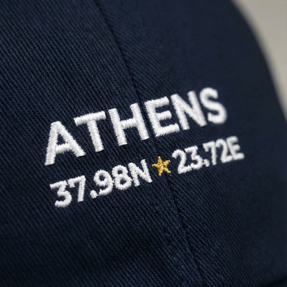 Macro close-up of Athens coordinates embroidery stitching on cotton cap.