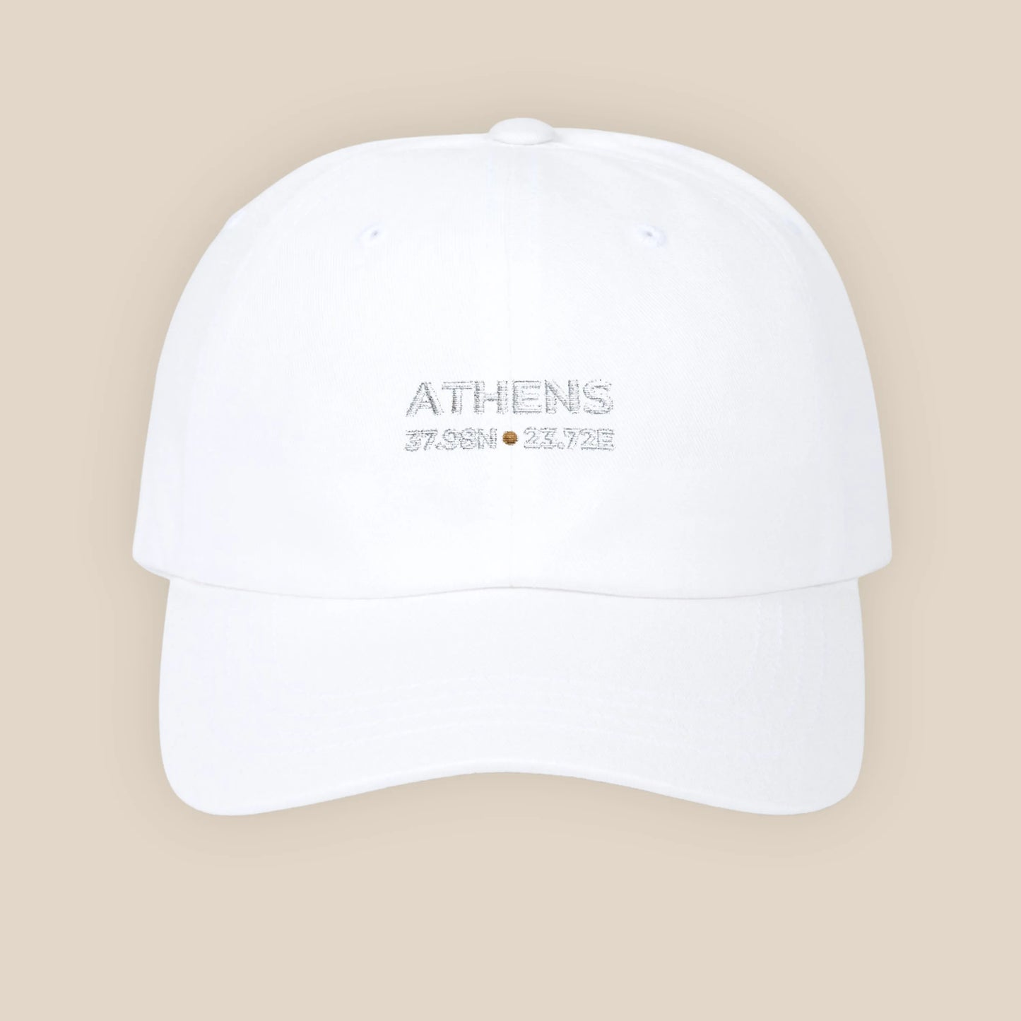 White cap with 'Athens 2023' text on a beige background