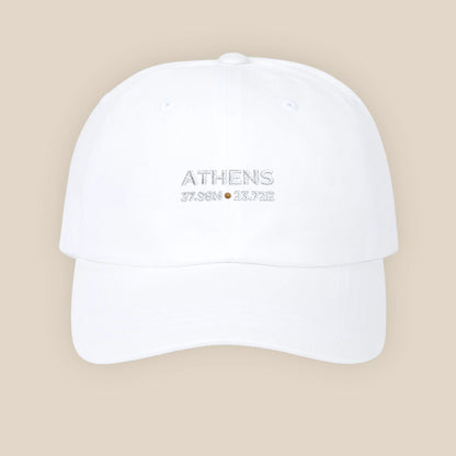 White cap with 'Athens 2023' text on a beige background