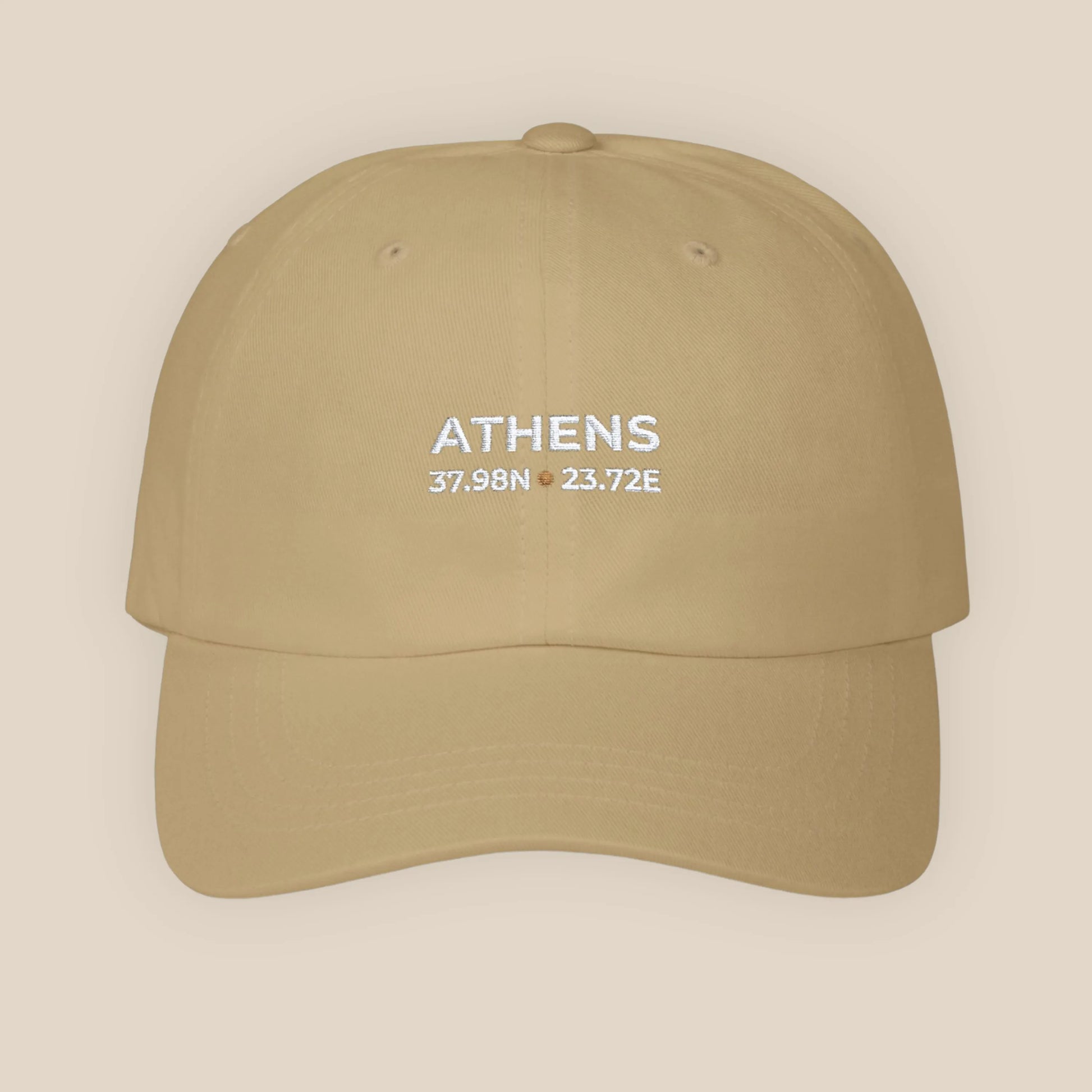 Khaki cap with 'ATHENS' and coordinates on a beige background