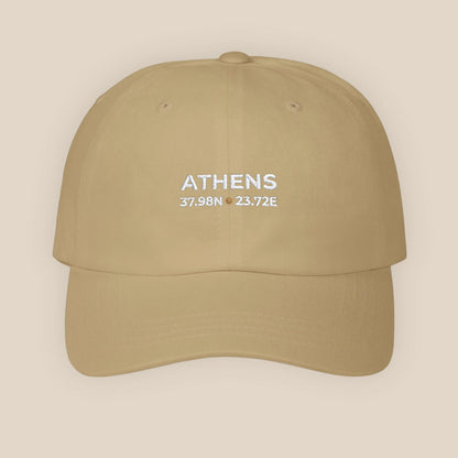 Khaki cap with 'ATHENS' and coordinates on a beige background