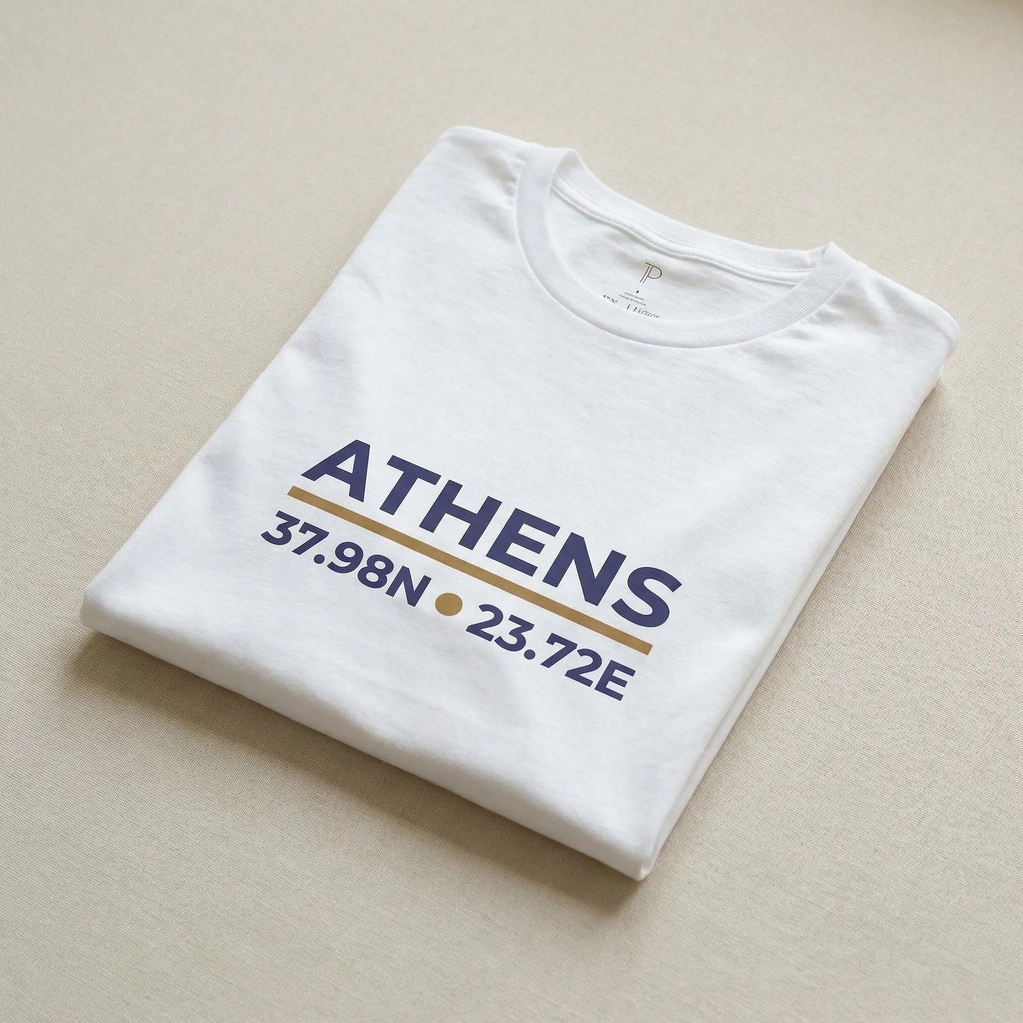 Folded white Athens coordinates t-shirt with city name and latitude longitude print visible
