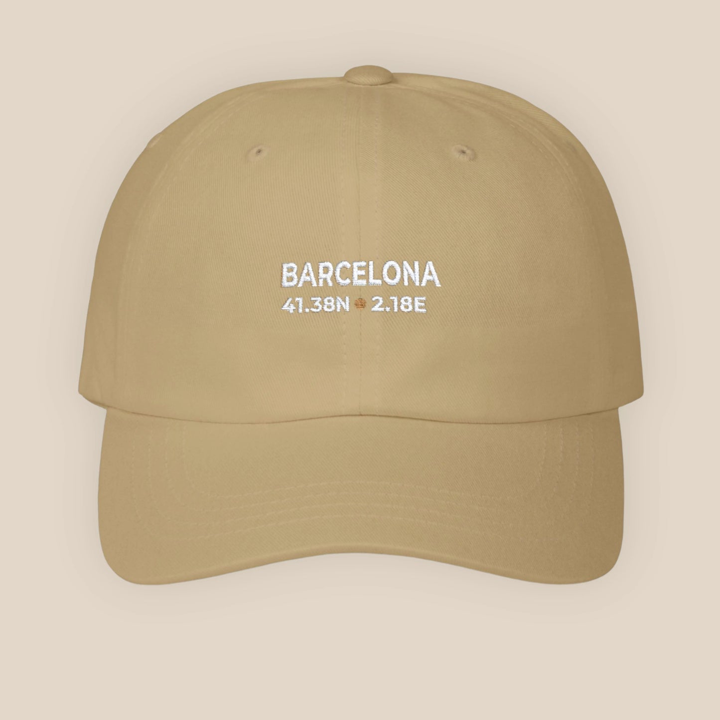 Beige cap with 'Barcelona' and coordinates on a beige background