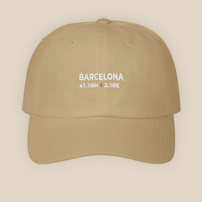 Beige cap with 'Barcelona' and coordinates on a beige background