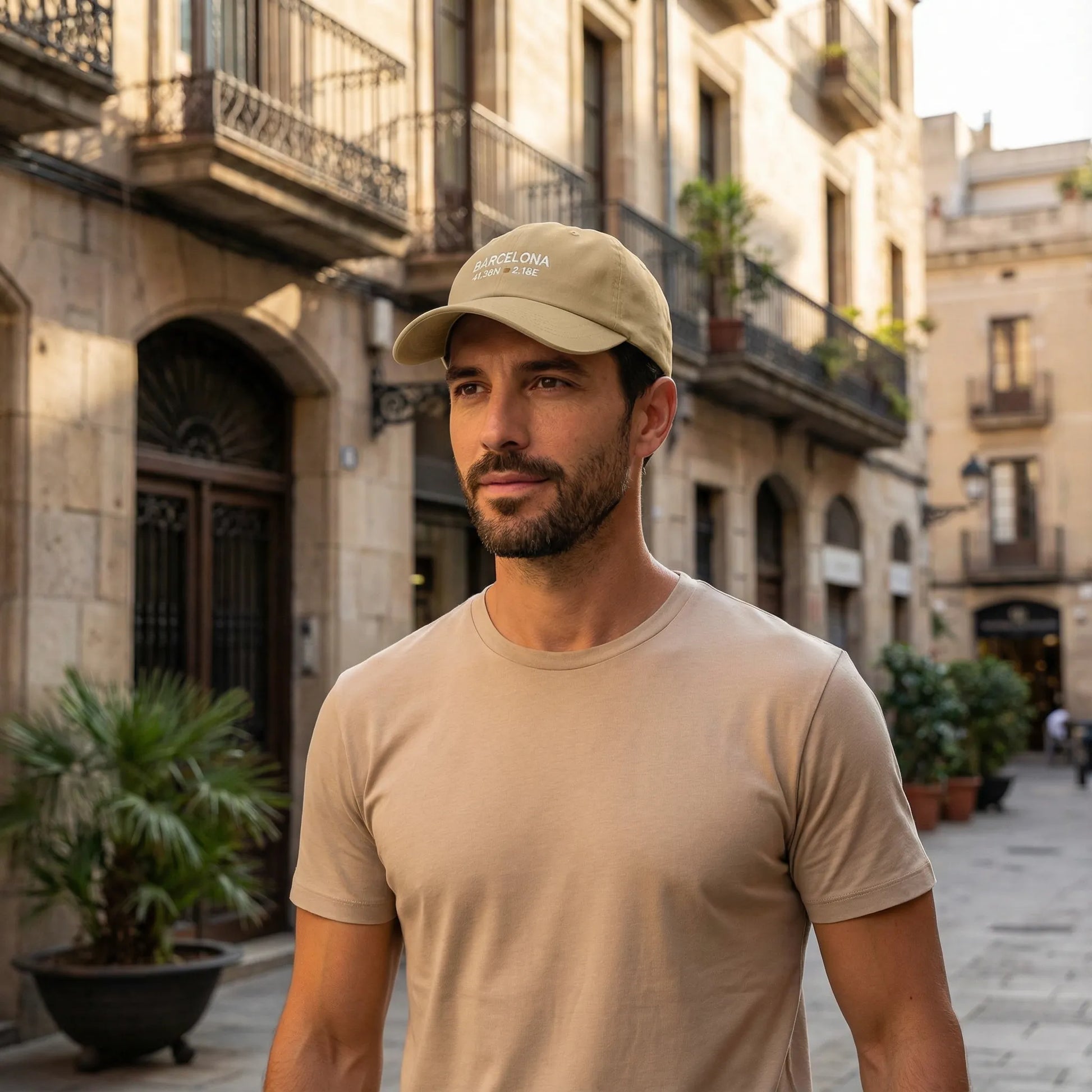 Barcelona coordinates embroidered dad cap worn outdoors in Mediterranean city