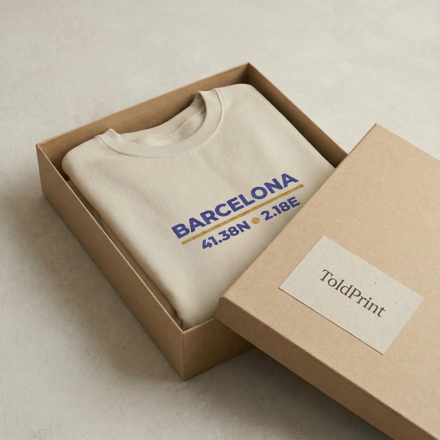 Barcelona coordinates embroidered sweatshirt folded in kraft packaging with ToldPrint label