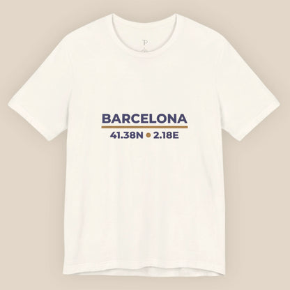 White t-shirt with 'Barcelona' and coordinates printed on a beige background