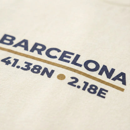 Text displaying 'BARCELONA 41.38N 2.18E' on a beige background
