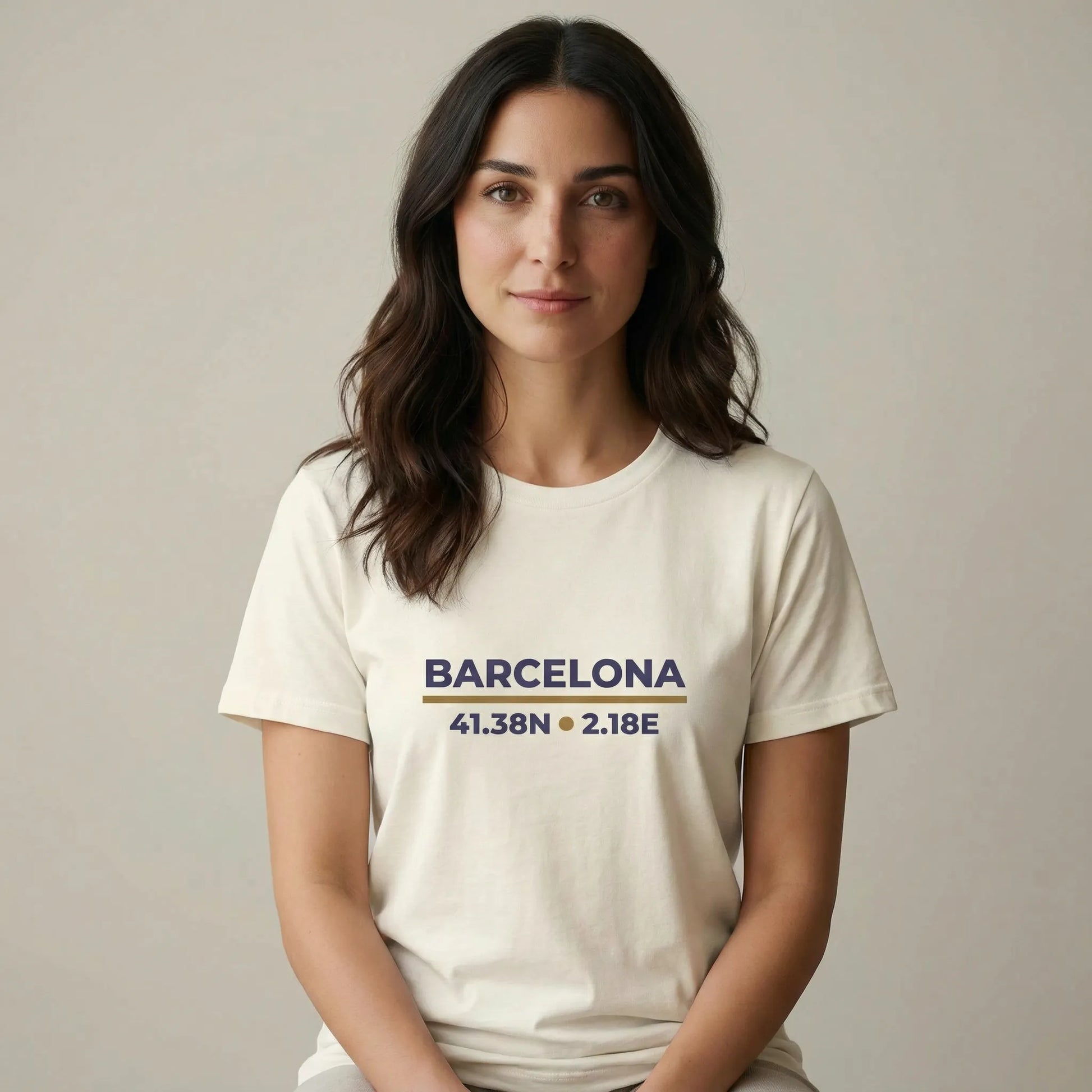 TP:HERO Woman wearing a white t-shirt with 'Barcelona' coordinates on a plain background