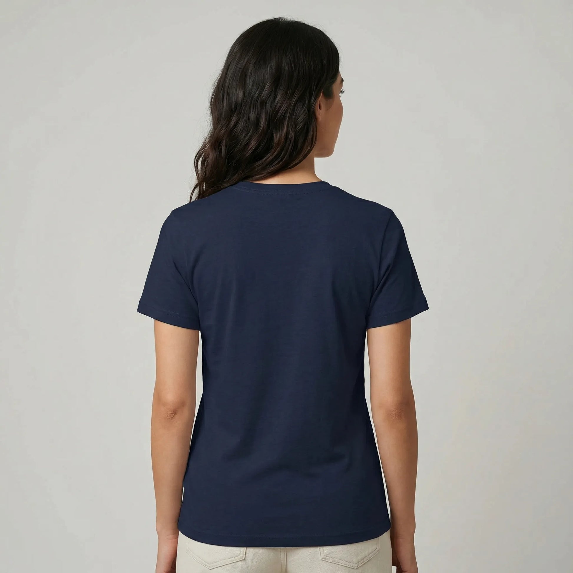 Person wearing a navy blue t-shirt on a plain background