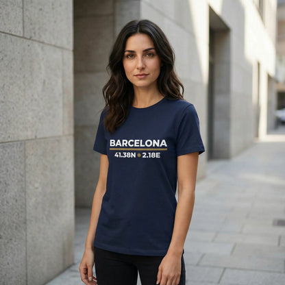 Woman wearing a navy blue t-shirt with 'Barcelona' and coordinates printed on it, standing in an urban setting.