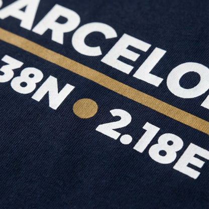 Navy blue shirt with white text and a gold line on a dark background