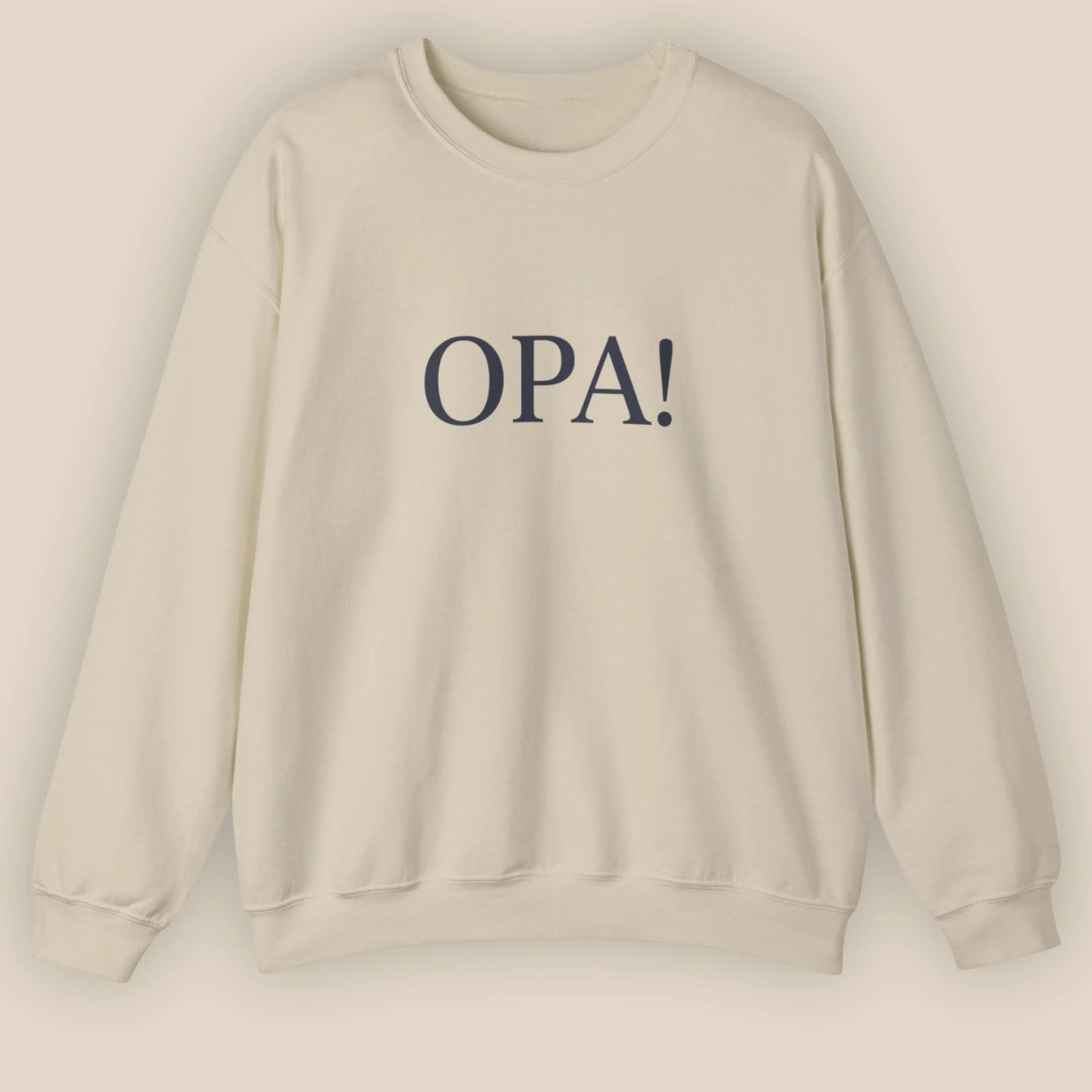 Flat lay of sand Celebratory OPA crewneck sweatshirt with minimal OPA typography on front