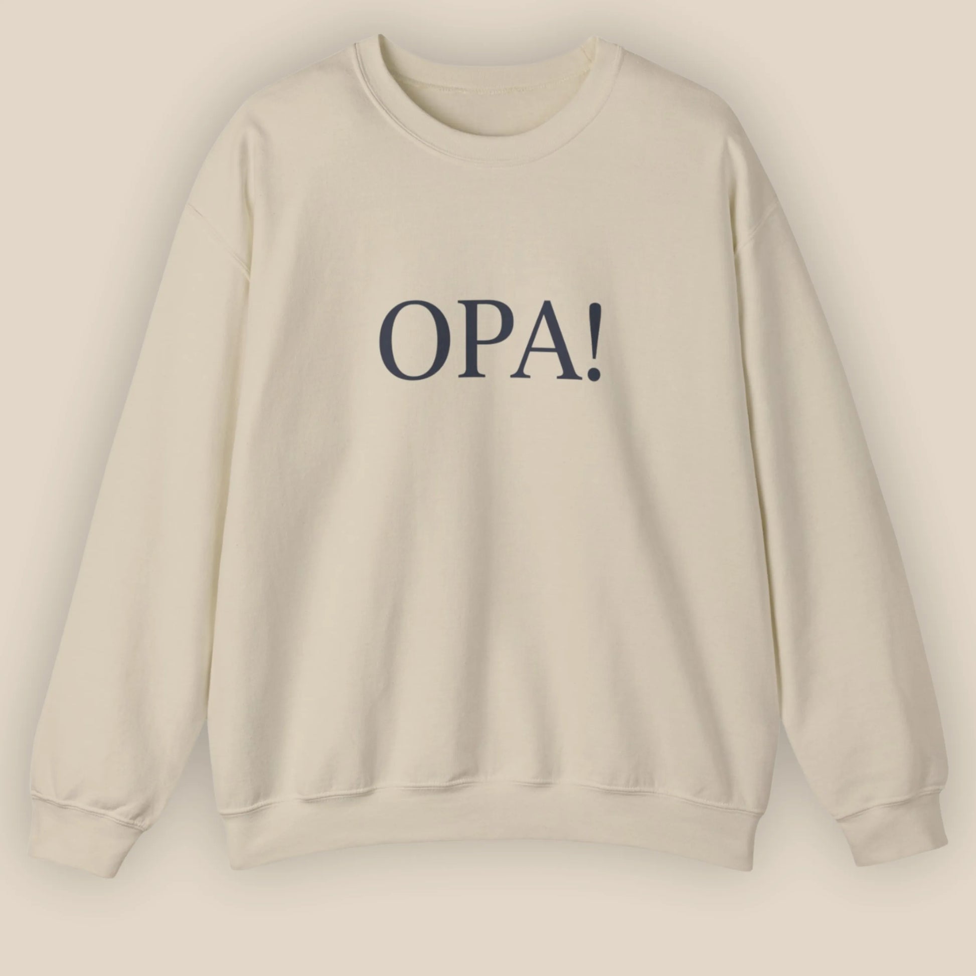 Flat lay of sand Celebratory OPA crewneck sweatshirt with minimal OPA typography on front