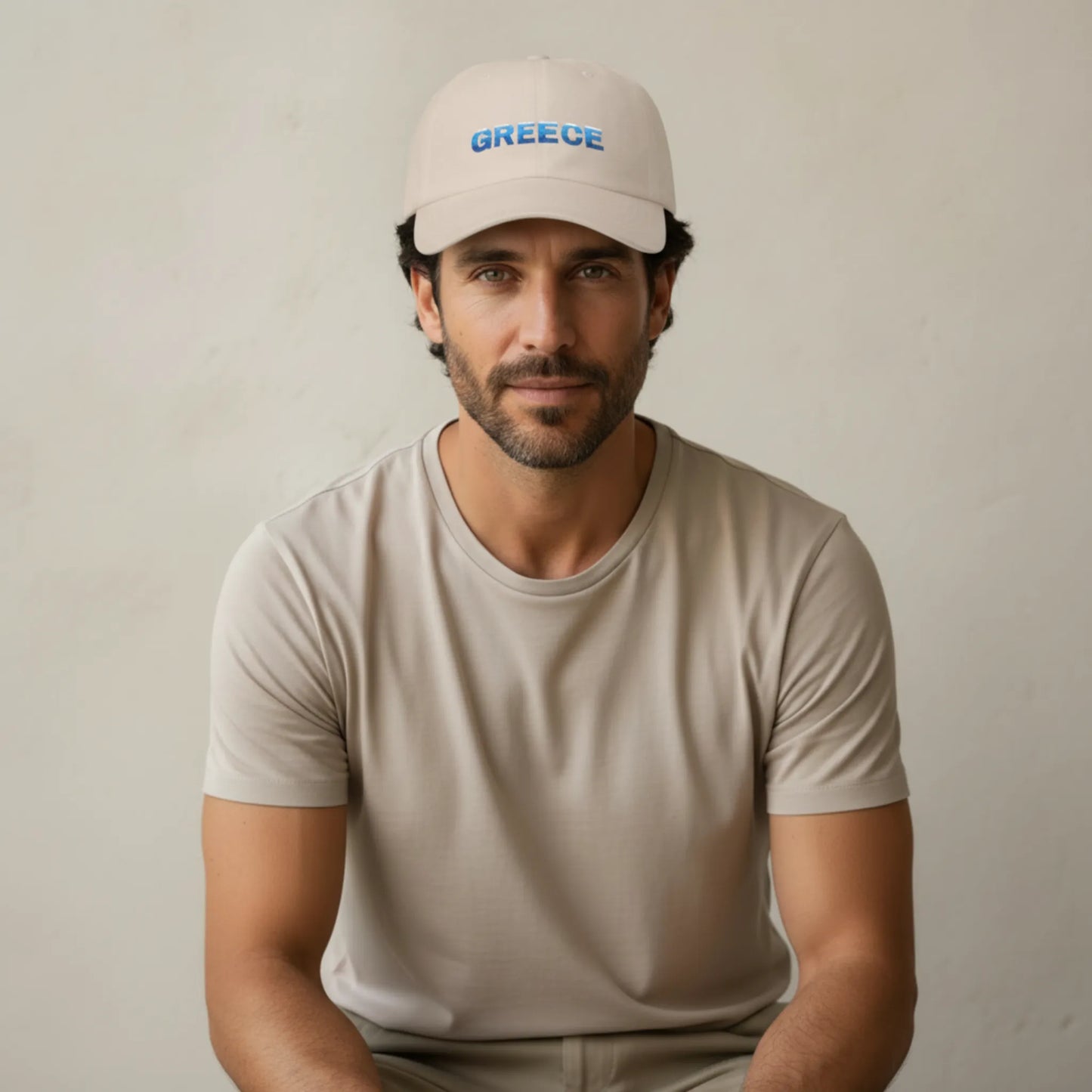 TP:HERO Unisex model wearing sand Greece Classic embroidered cotton dad cap with Greece text on front