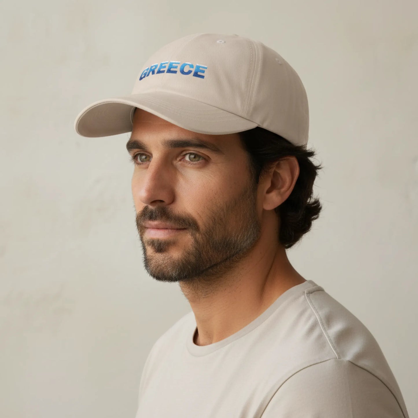 Side view of sand Greece Classic dad cap showing low profile unstructured fit and curved visor