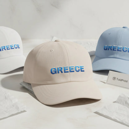 Greece Classic dad caps folded with Greece text visible and minimal ToldPrint packaging