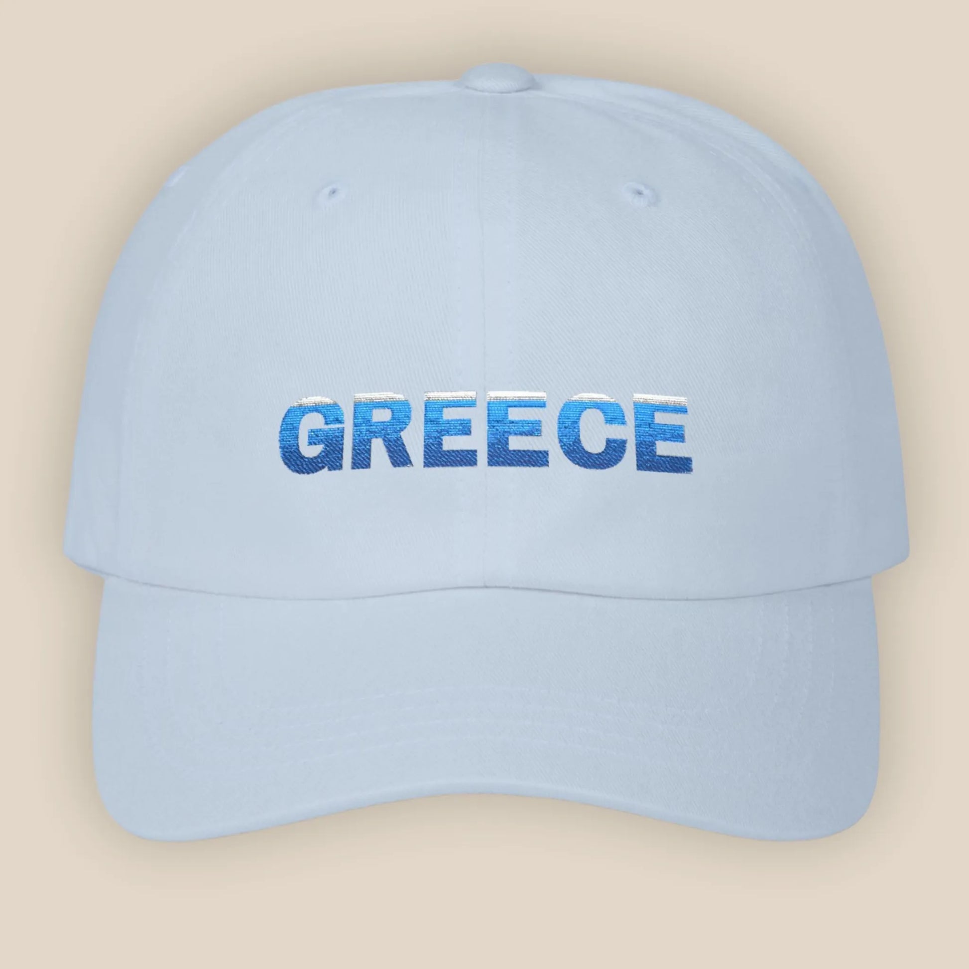 Flat lay of light blue Greece Classic embroidered cotton dad cap showing Greece text on front panel