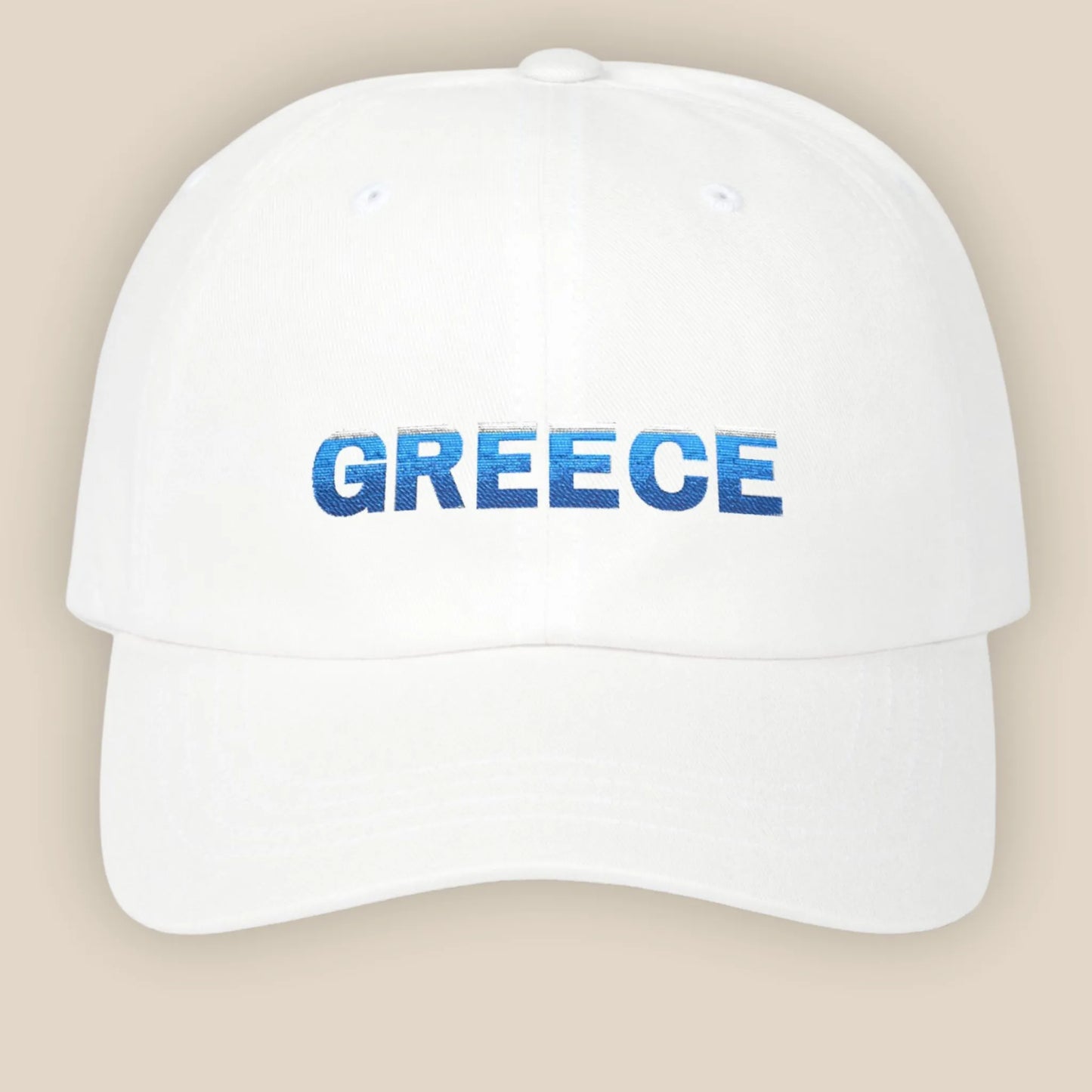 Flat lay of white Greece Classic embroidered cotton dad cap showing Greece text on front panel