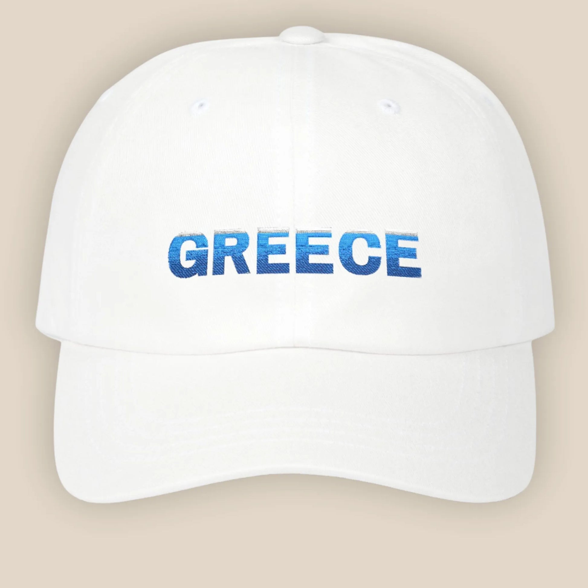 Flat lay of white Greece Classic embroidered cotton dad cap showing Greece text on front panel