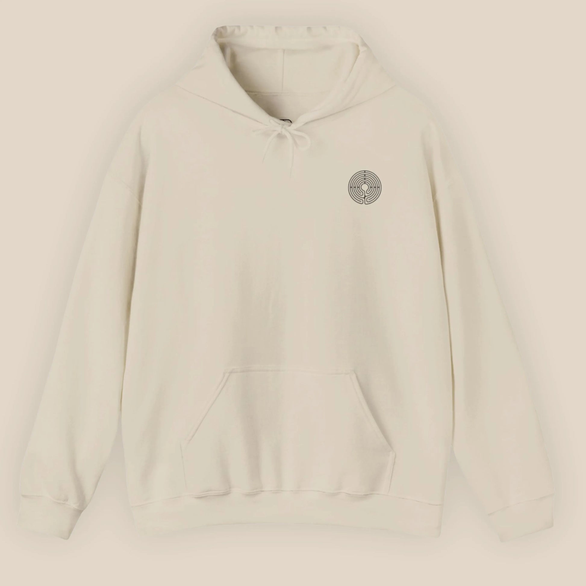 Flat lay of Labyrinth Hoodie in Sand displaying the circular labyrinth print