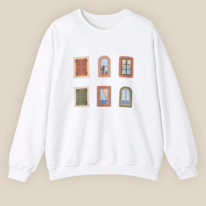White sweatshirt with window illustrations on a beige background
