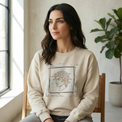 Indoor 3/4 lifestyle view showing Minimal Medusa design on Sand unisex crewneck