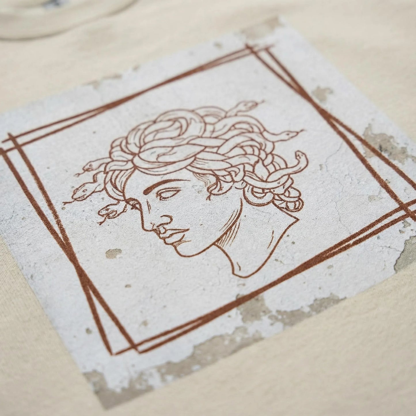 Macro close-up of Minimal Medusa DTG print on fleece fabric