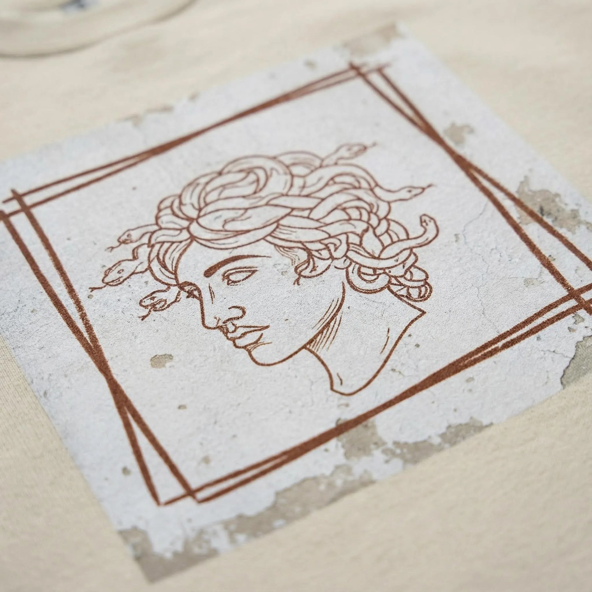 Macro close-up of Minimal Medusa DTG print on fleece fabric