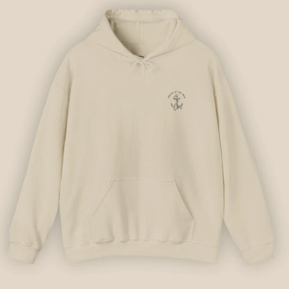 Flat lay of Monk Seal Embrace hoodie in sand colour with ocean conservation design