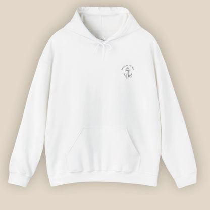 Flat lay of Monk Seal Embrace hoodie in white colour with ocean conservation design