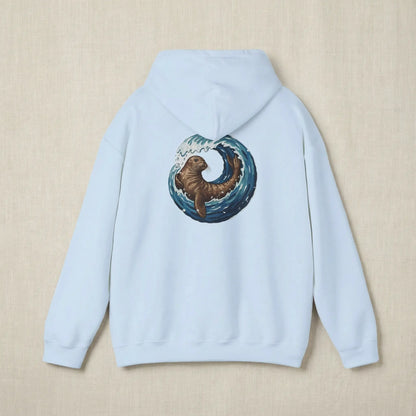 Flat lay of Monk Seal Embrace hoodie showing full back monk seal and wave print